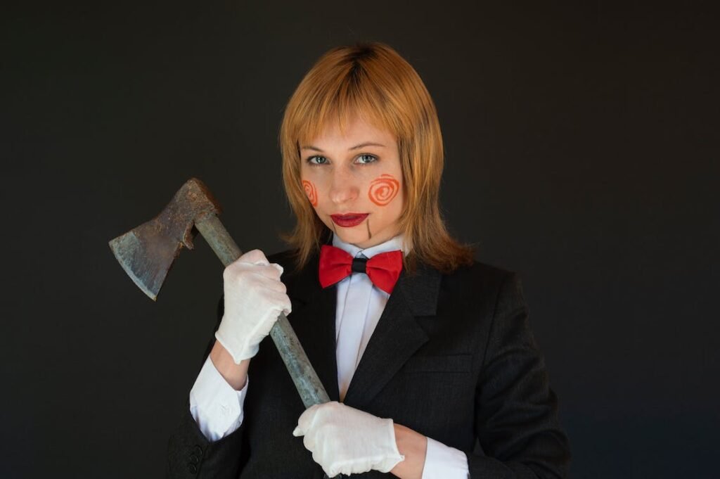 A focused woman in a sleek black costume, confidently holding an axe with both hands, ready to demonstrate axe throwing fundamentals